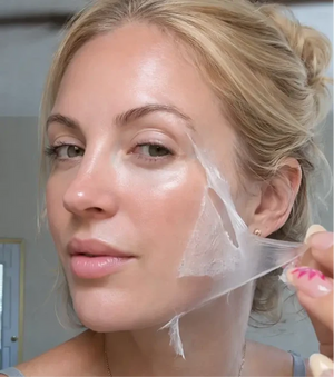 Customer holding Glow SkinCo™ mask